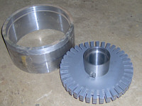 Roughly machined flux ring and some stator plates stacked