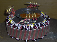 The stator wound and terminated - Note the skewed slots